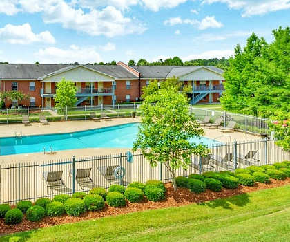 Open Green Space and Resort-Style Pool at Regal Pointe Apartments in Tuscaloosa, AL