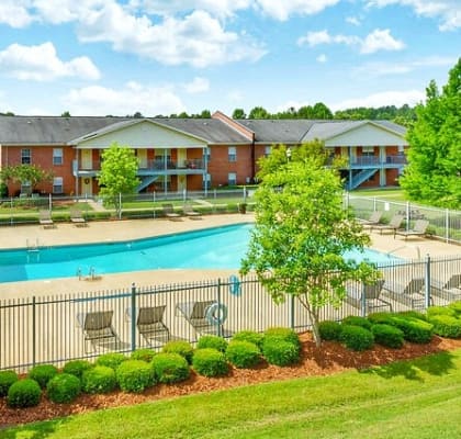 Open Green Space and Resort-Style Pool at Regal Pointe Apartments in Tuscaloosa, AL