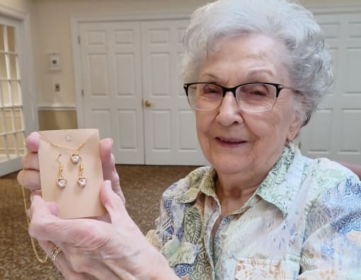 Resident shows of her gift at Elison Independent and Assisted Living of Maplewood