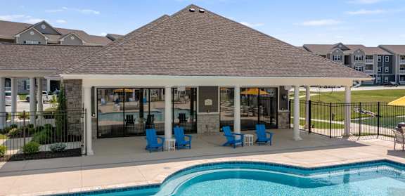 A pool with a building in the background at Aventura at Wentzville I & II Apartments, Wentzville, 63385