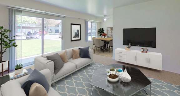A living room with a white couch, a black television, and a coffee table.