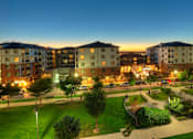 Thumbnail 18 of 22 - Liberty Gateway Apartments, Salt Lake City, Utah, exterior with park area with a walking path and grassy area.