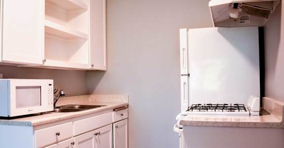 kitchen with white cabinets and light countertops