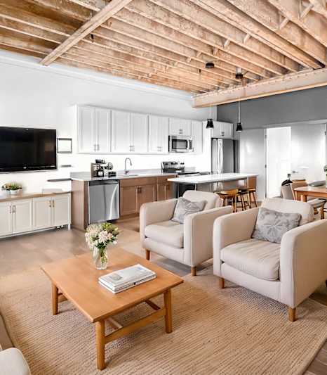 A room with wooden floors and a white wall.at Plant 1 Lofts, N. Newton