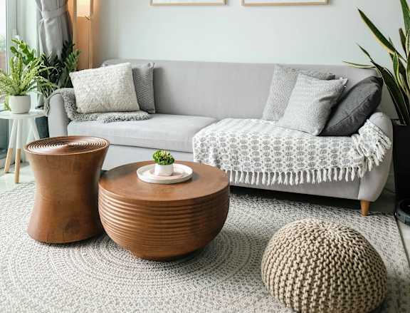 a living room with a couch and a ceiling fan
