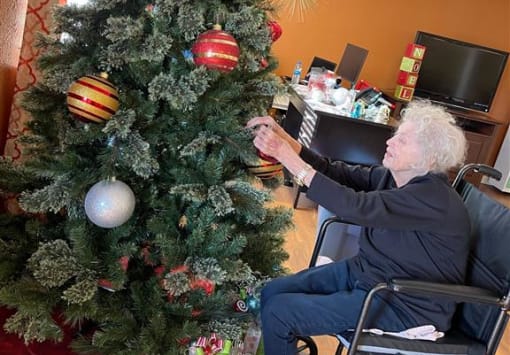 resident decorating the tree