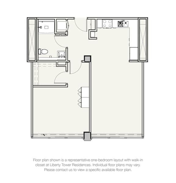 A floor plan of a one-bedroom apartment with a walk-in closet at Liberty Tower Residences.