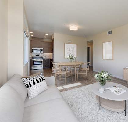 a living room with a couch and a table and a television