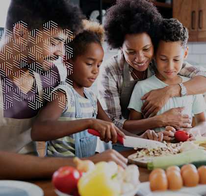 Family of Four in Kitchen Making Food