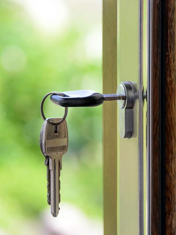 a door handle with keys hanging out of it