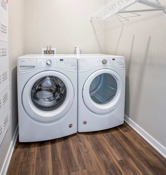 Front loading washer and dryer in a laundry room