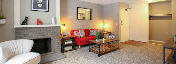 A living room with a fireplace and a couch.