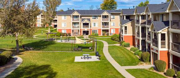 A sunny day at a residential complex with a clear blue sky.