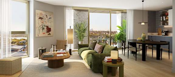 A modern living room with a green sofa and a coffee table.