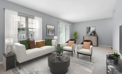 a living room with grey walls and white couches and chairs at West Pointe Apartments in Burlington, NC