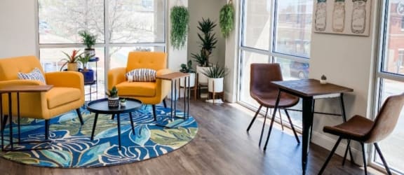 Resident lounge with comfortable chairs and table