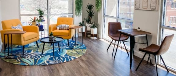 Resident lounge with comfortable chairs and table