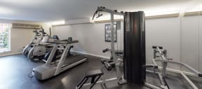 a gym with treadmills and other exercise equipment in a building