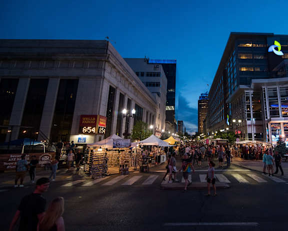 people walking through a street festival in a city at night at The Hive Apartments, Allentown, PA, 18101