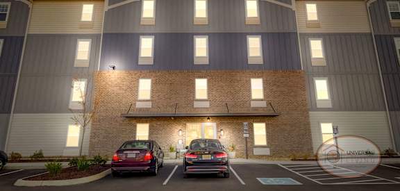 a building with cars parked in front of it