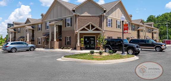 a large building with cars parked in front of it