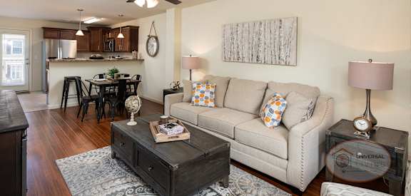 an open living room and kitchen with a couch and a table