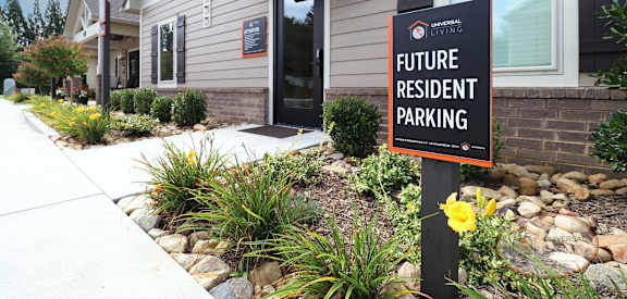 a house with a future resident parking sign in front of it