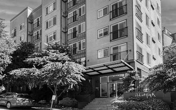 a black and white photo of an apartment building