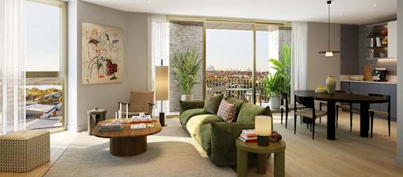 A modern living room with a green sofa and a coffee table.