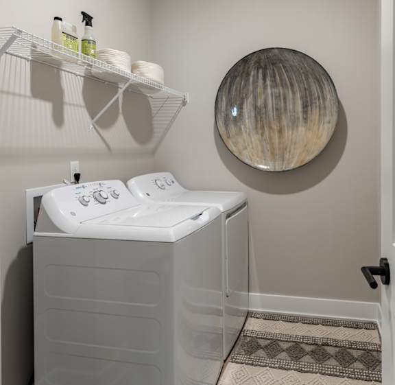 a small bathroom with a sink and a mirror on the wall