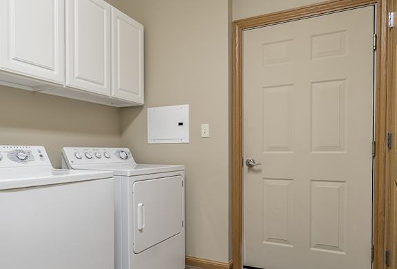 A laundry room with a washer and dryer.