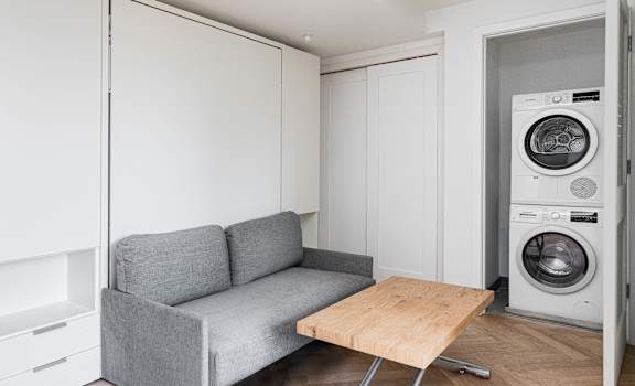 Studio apartment with built in murphy bed, couch and in unit washer/dryer