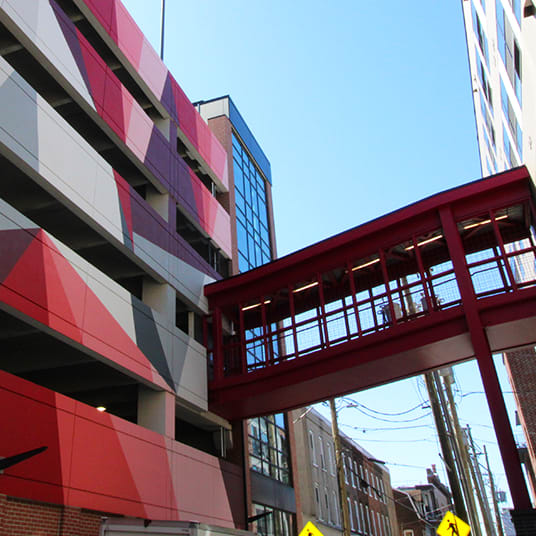 A red bridge connects two buildings. at The Gallery Apartment Homes Apartments, Allentown, PA, 18101
