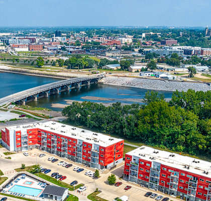 an aerial view of a city with buildings and a river
