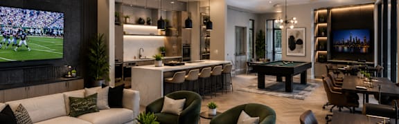 A modern living room with a large TV screen and comfortable seating.