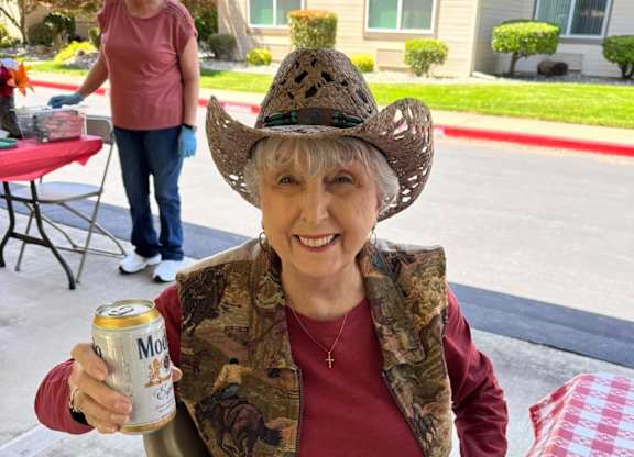 A woman in a cowboy hat at River Commons Senior Living, Redding, CA