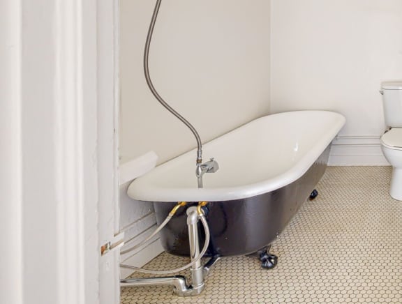 a bathroom with a bathtub and a toilet