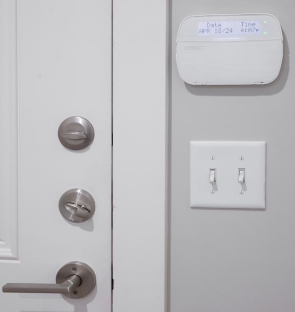 a door with a sensor on it and a door handle