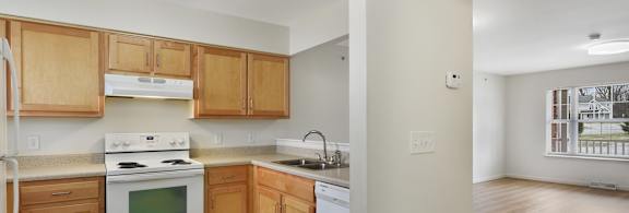 a kitchen and living room in a 555 waverly unit at Creekwood Apartments, Watertown, 13601
