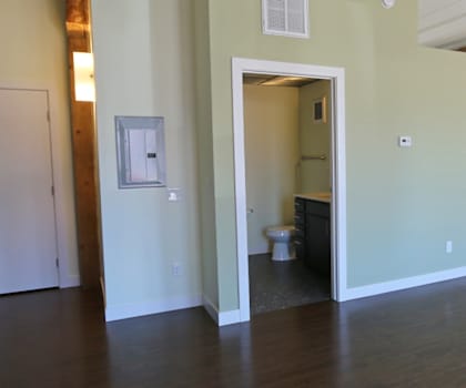 an open living room and kitchen area in a 555 waverly unit