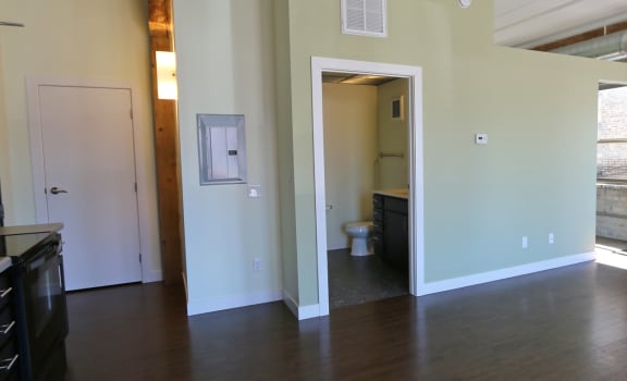 an open living room and kitchen area in a 555 waverly unit