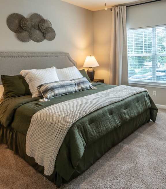 Bedroom with Nightstand at Ansley at Town Center Apartments, Evans, 30809