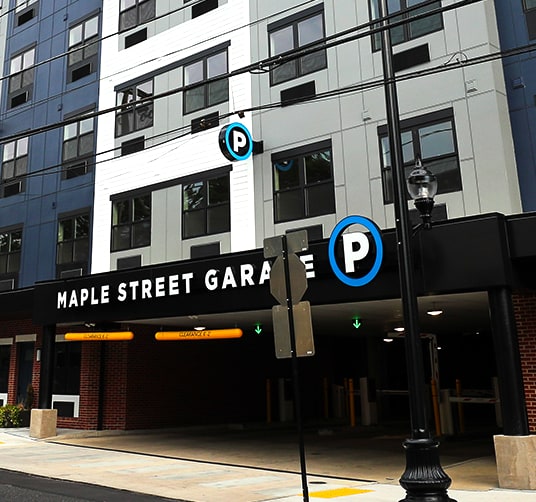 A parking sign is displayed in front of a Maple Street Garage. at Walnut View Apartments, Allentown, PA, 18102