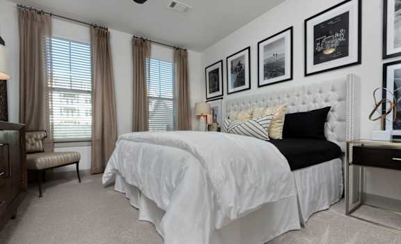 Carpeted bedrooms with ceiling fans