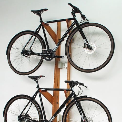 a bike rack with three bikes on it