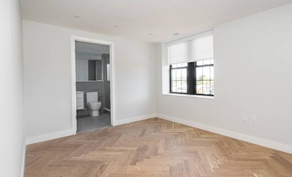 Bright bedroom with hardwood floors
