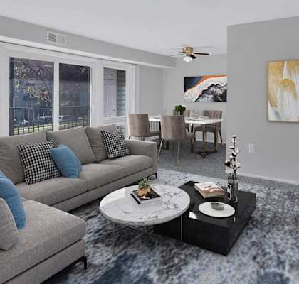 a living room with couches and a coffee table