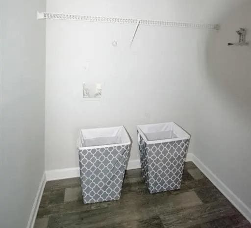a bathroom with two baskets on the floor