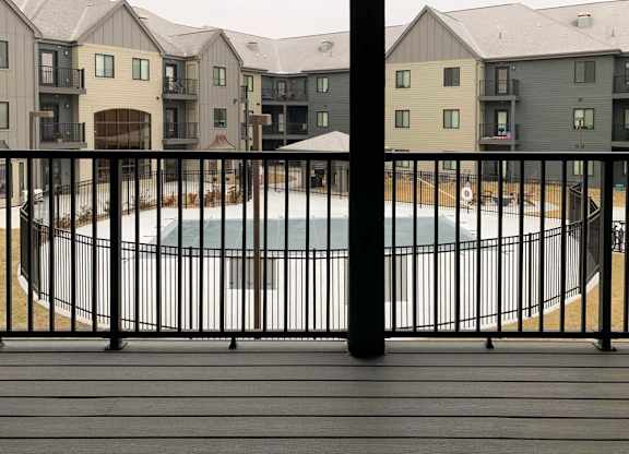 deck view of pool with black railing