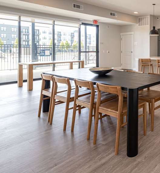 a kitchen and dining room with a table and chairs